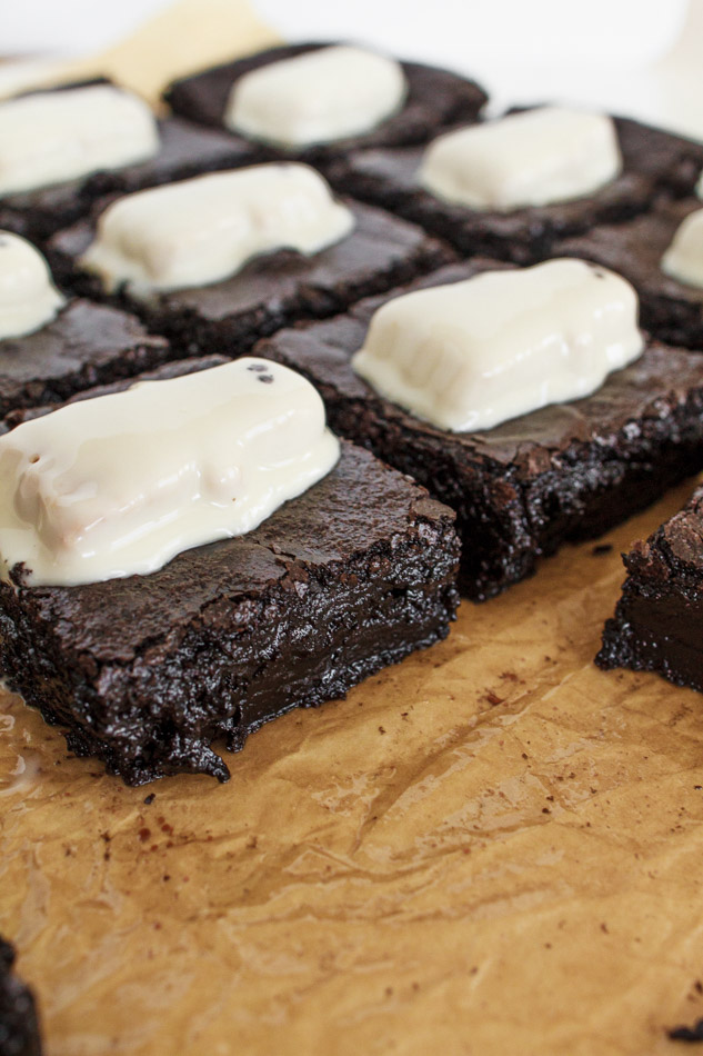 Ghost Brownies are the Halloween Dessert that is a must make this season!  The entire recipe is made in one bowl.  Mostly made with simple pantry ingredients like butter, chocolate chips and eggs.  It also includes black cocoa powder.  This coco powder adds the dark color you need to achieve the blackness that make these a little extra spooky!