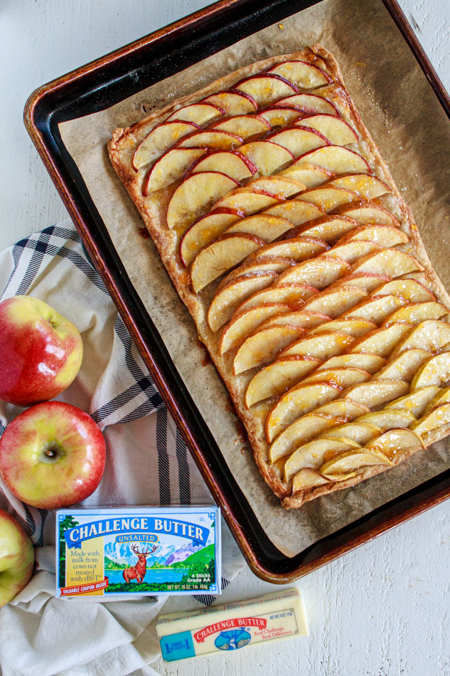 This Apple Tart is super simple to make!  Arrange an ombre array of apples, darkest to lightest, on a homemade pasty dough and baked to perfection.  Sweet and tart all on a flaky crust!  No pie plate is needed.  Super simple recipe and perfect for the holidays!