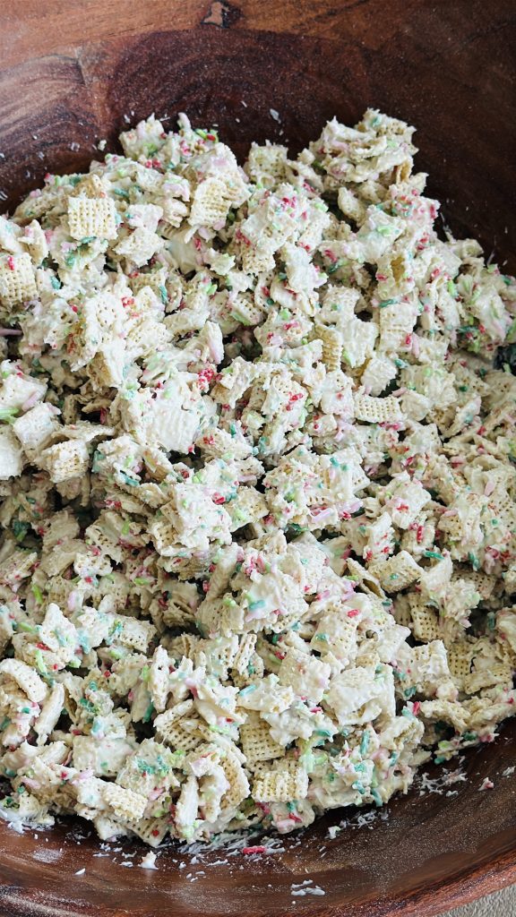 Christmas Cookie Muddy Buddies with white chocolate and red, green and pink sprinkles