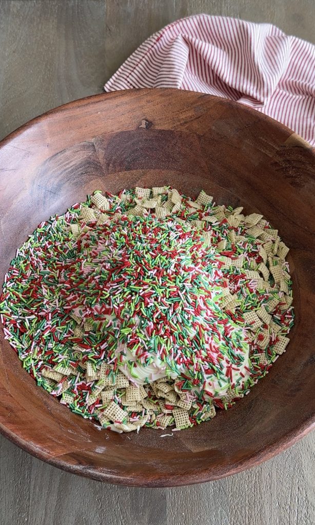 Christmas Cookie Muddy Buddies with white chocolate and red, green and pink sprinkles