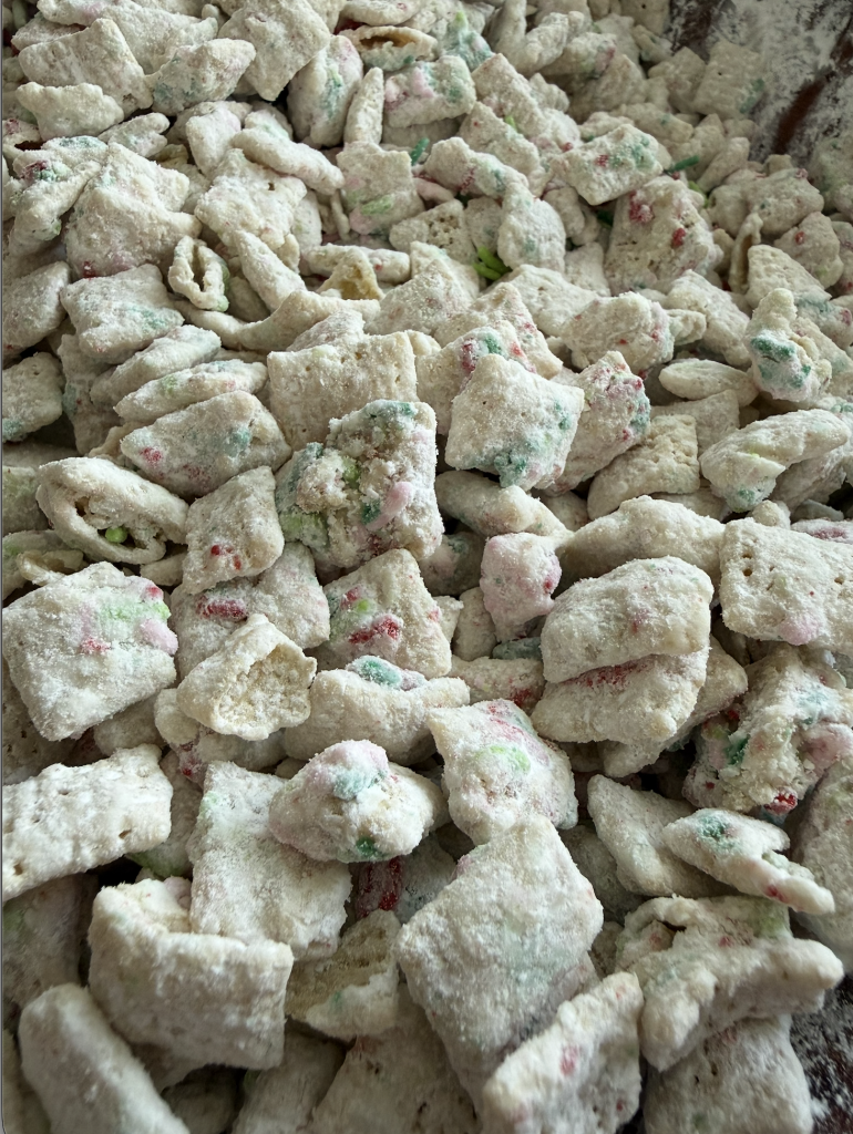 Christmas Cookie Muddy Buddies with white chocolate and red, green and pink sprinkles