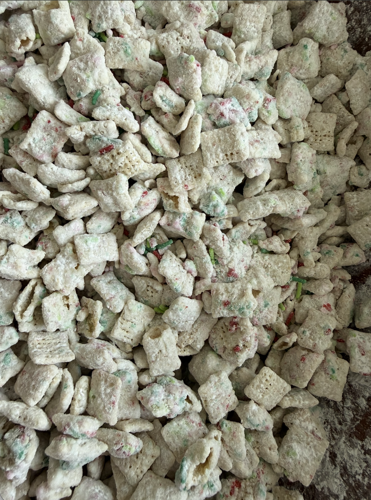 Christmas Cookie Muddy Buddies with white chocolate and red, green and pink sprinkles